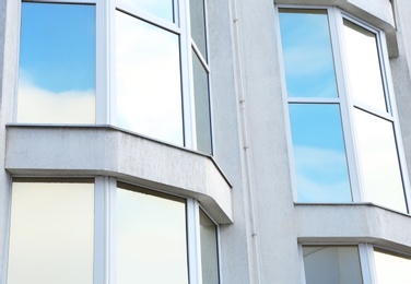 Modern office building with tinted windows. Urban architecture