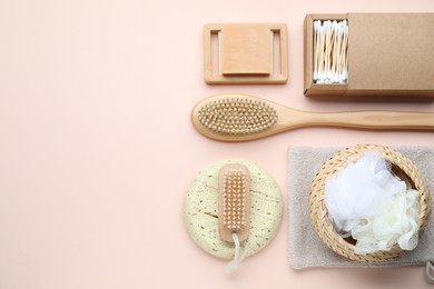 Bath accessories. Flat lay composition with personal care products on pink background, space for text