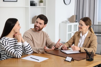 Photo of Couple having meeting with lawyer in office