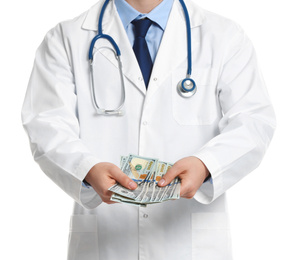 Photo of Doctor with bribe on white background, closeup. Corruption in medicine