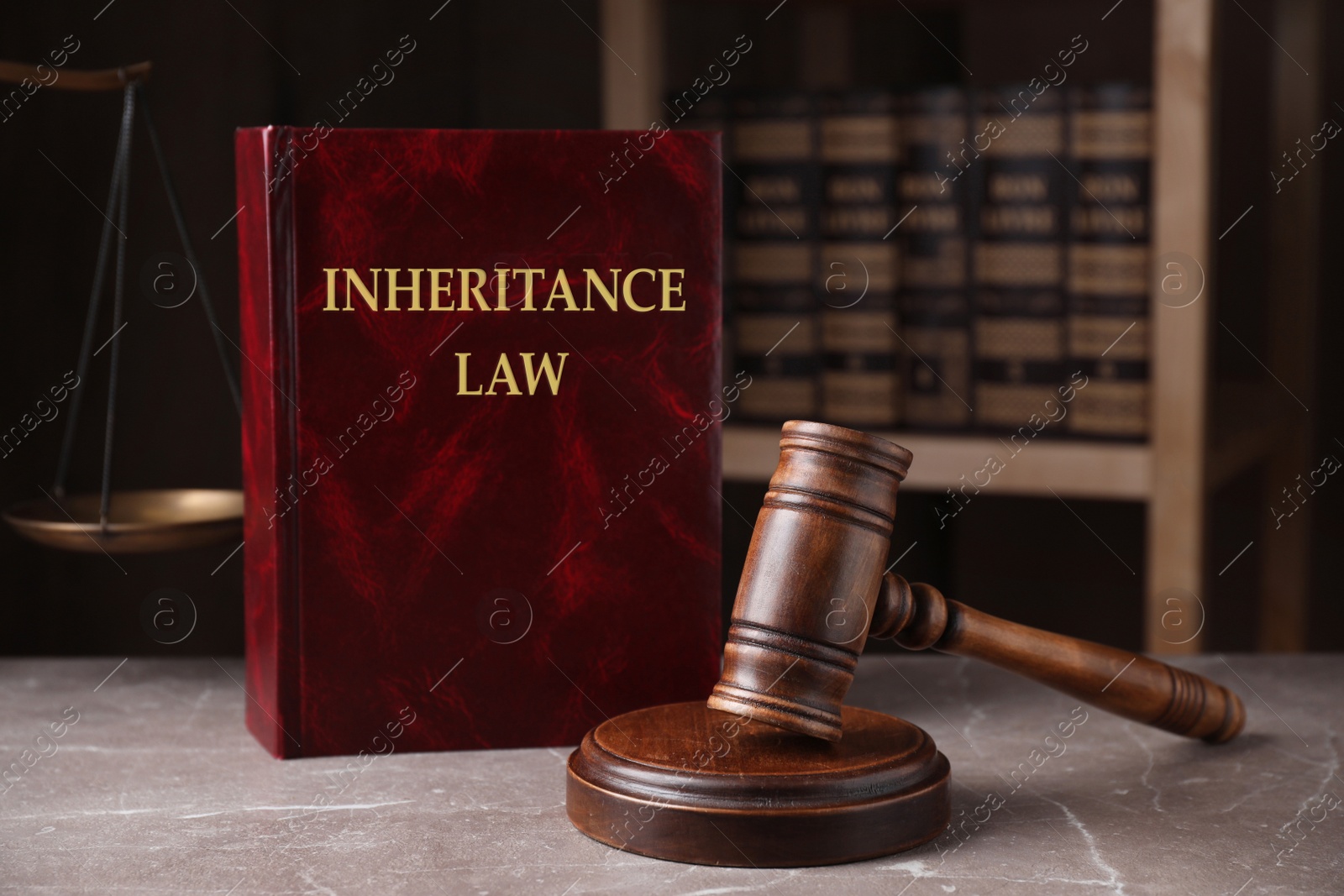 Image of Inheritance law and gavel on grey marble table, closeup