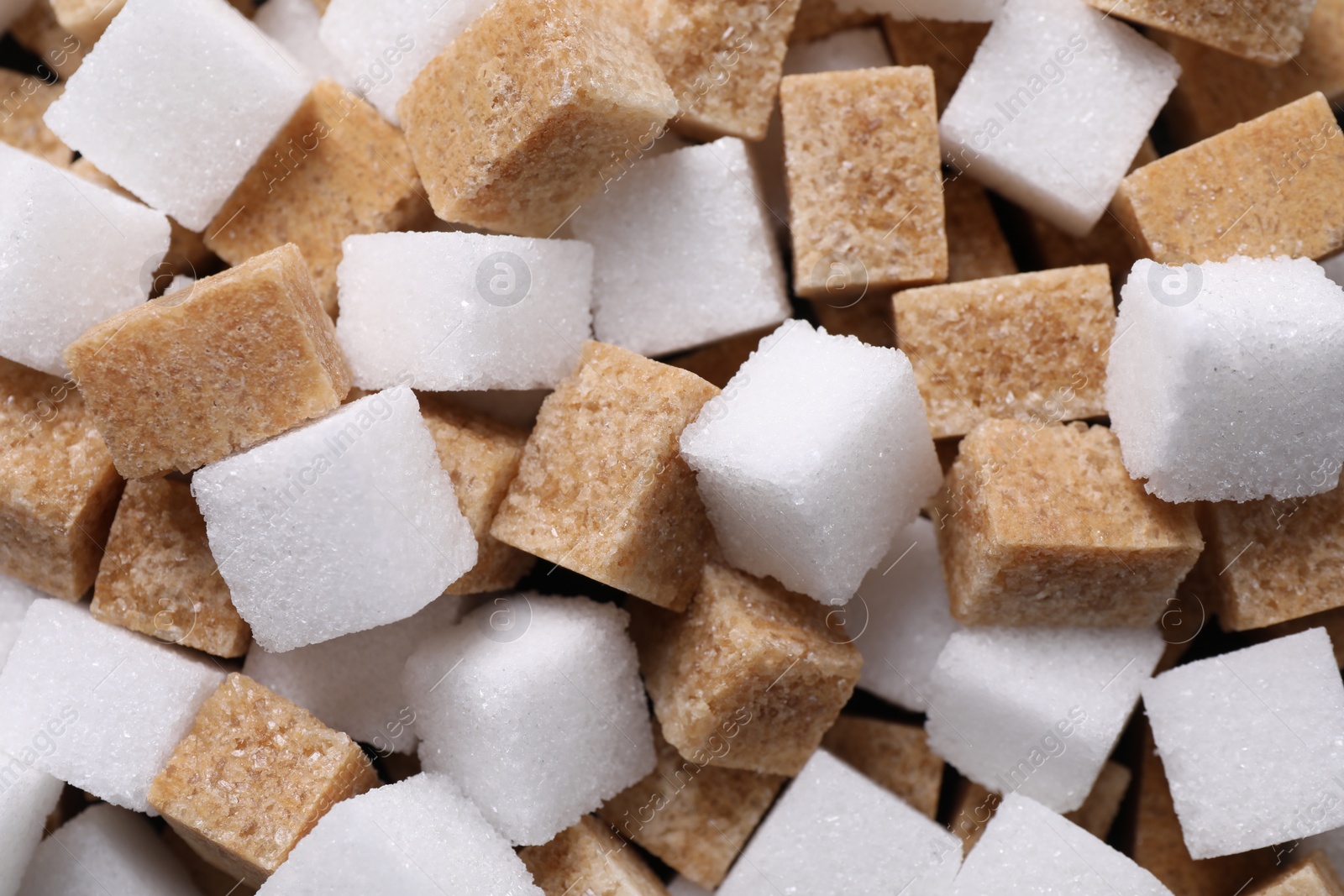 Photo of White and brown sugar cubes as background, top view