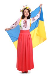 Happy woman in national clothes with flag of Ukraine on white background
