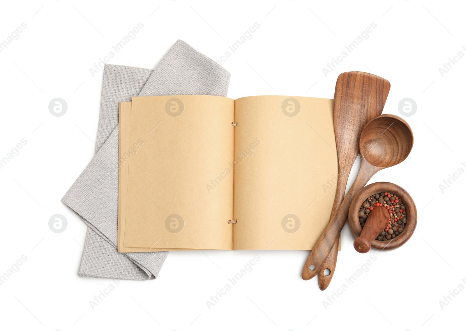Photo of Blank recipe book, spices, napkin and wooden utensils on white background, top view. Space for text