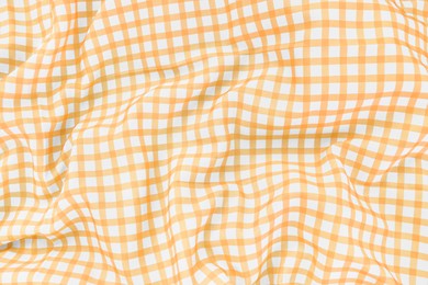 Photo of Yellow checkered picnic tablecloth as background, top view