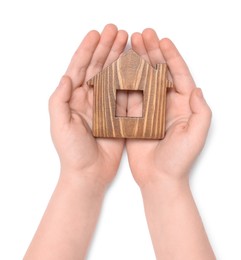 Photo of Home security concept. Little child holding house model on white background, top view