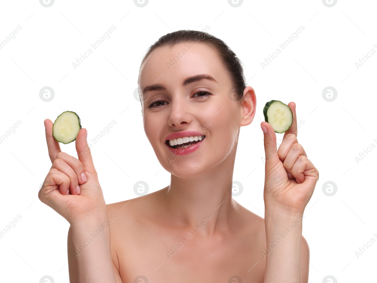 Photo of Beautiful woman with pieces of cucumber on white background