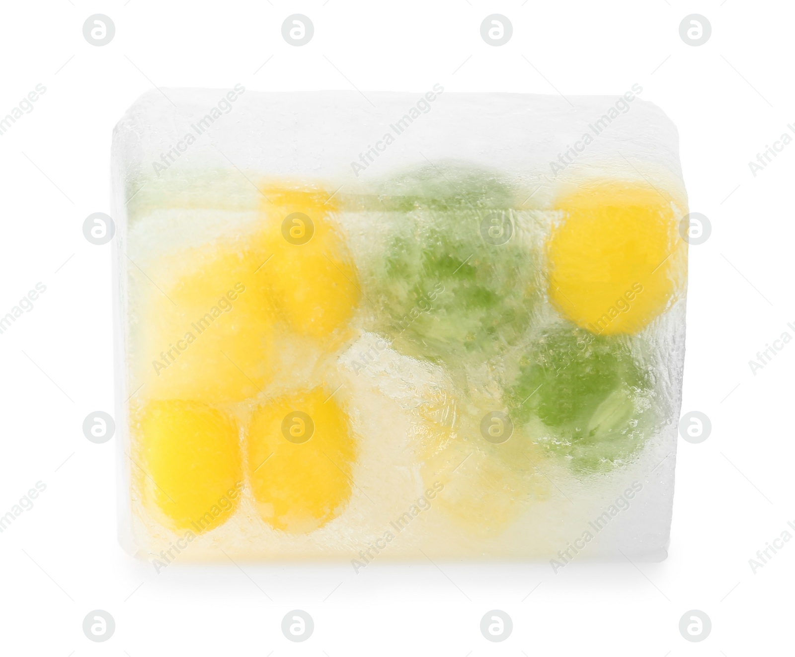 Photo of Corn grains and green peas in ice cube on white background. Frozen vegetables