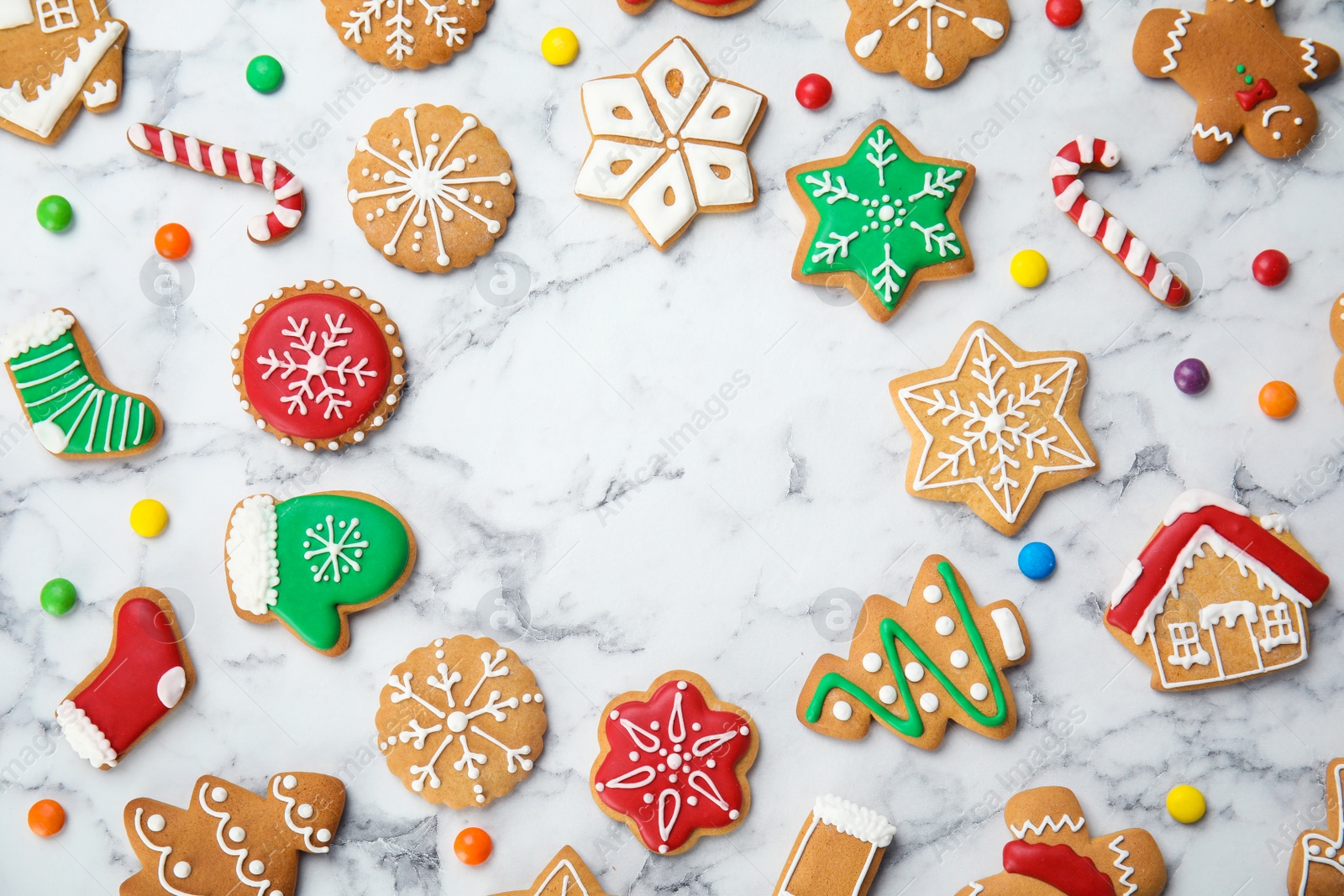 Photo of Tasty homemade Christmas cookies on marble table, top view