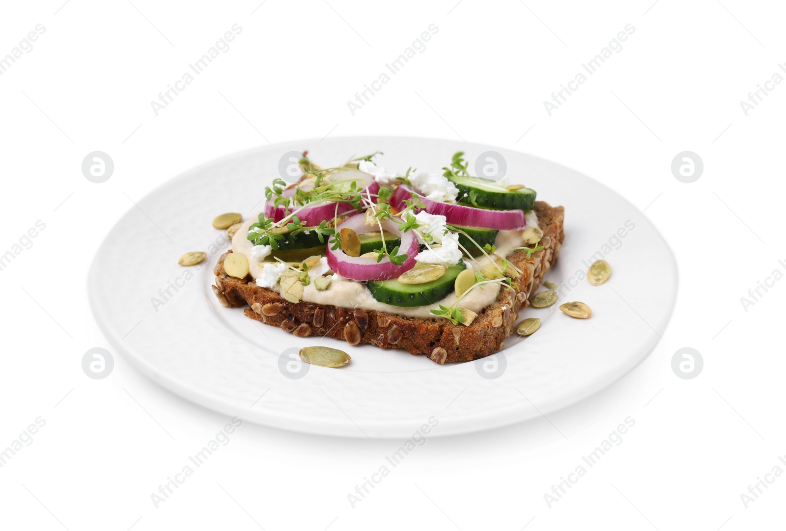 Photo of Tasty vegan sandwich with cucumber, onion, hummus and pumpkin seeds isolated on white