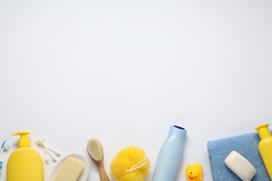 Photo of Baby bath accessories and care products on white background, flat lay. Space for text