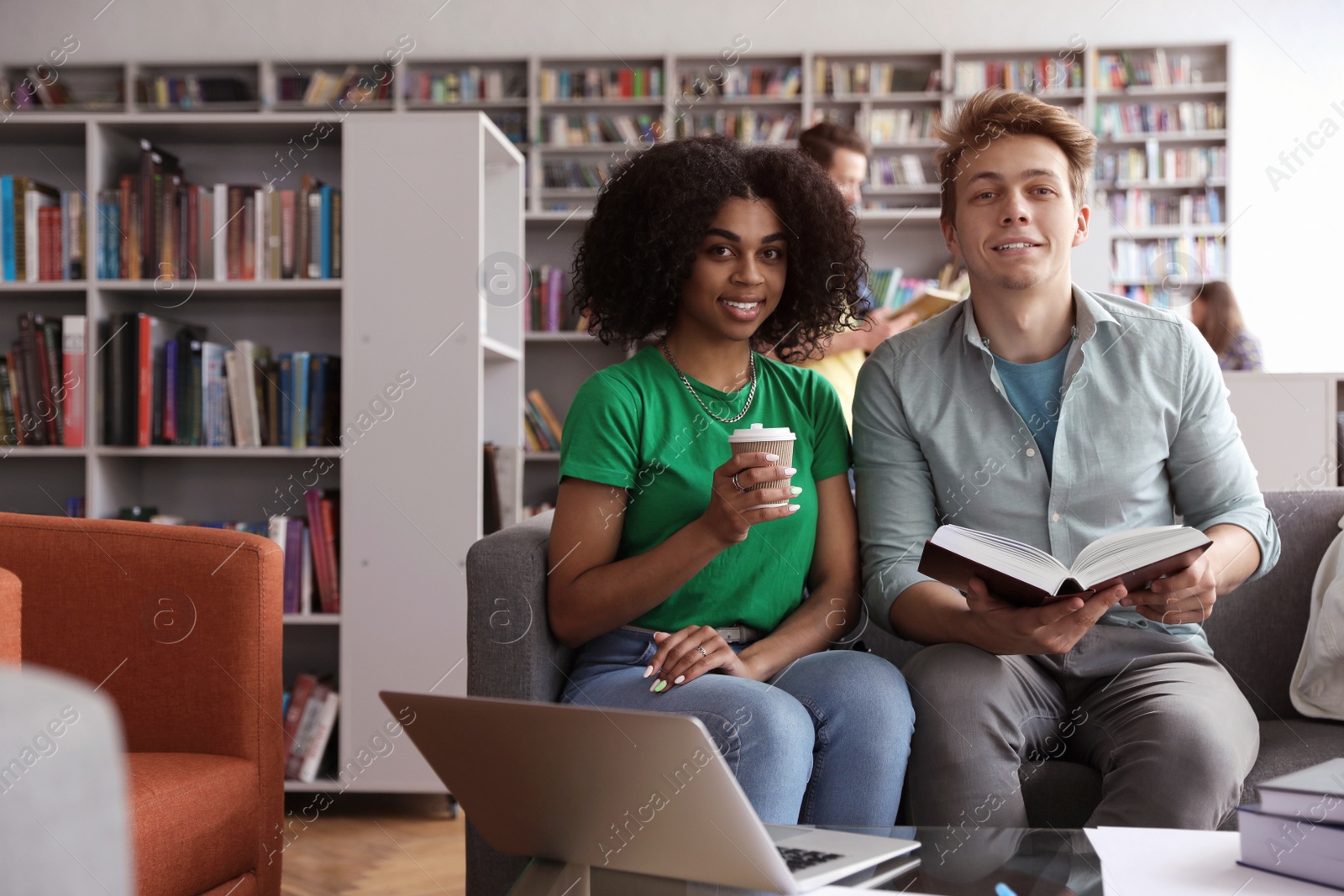 Photo of Group of young people studying in library