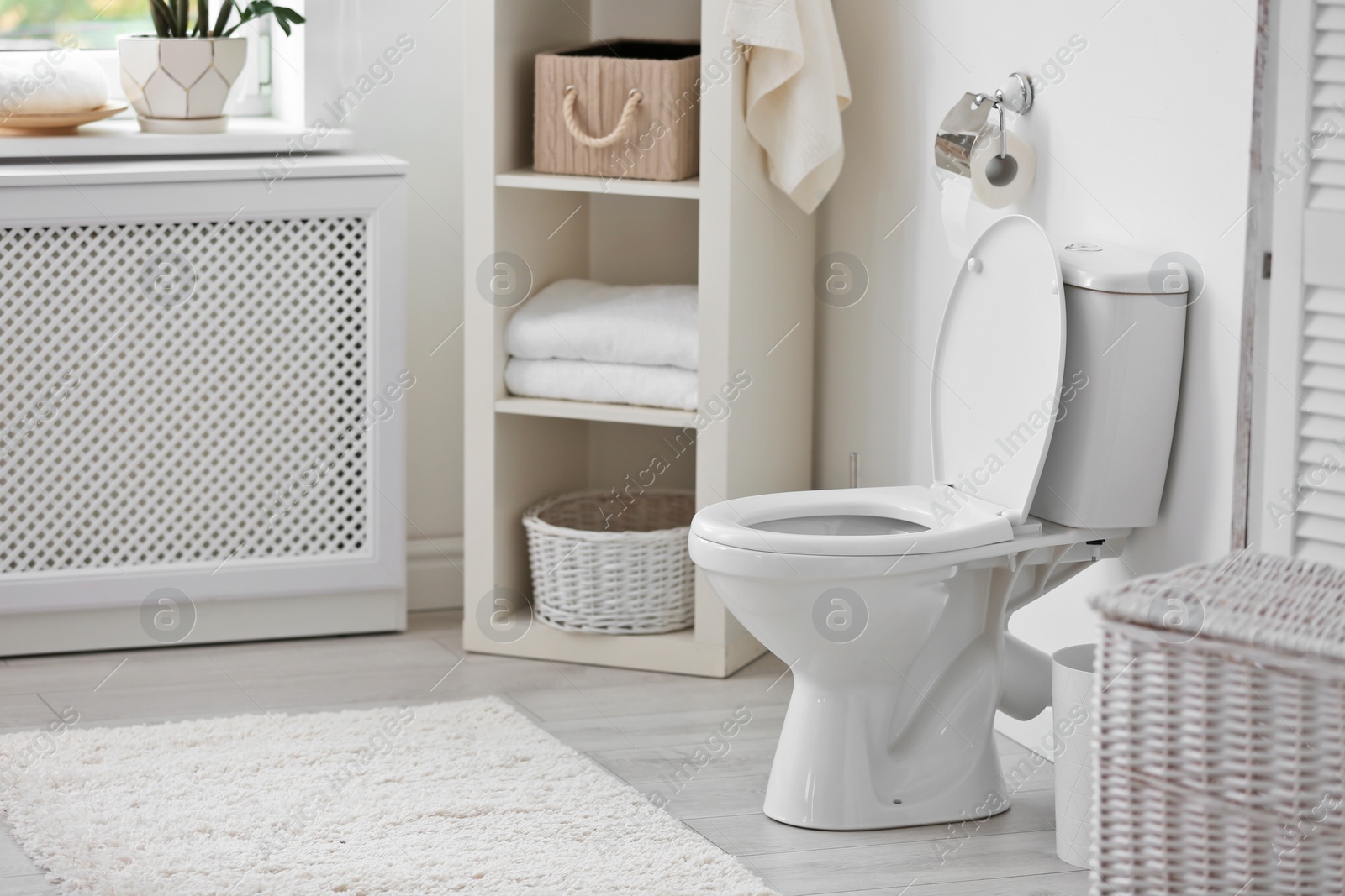 Photo of Toilet bowl in modern bathroom interior