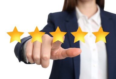 Image of Quality evaluation. Businesswoman touching virtual golden star on white background, closeup