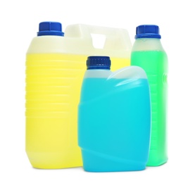 Photo of Plastic canisters with different liquids for car on white background