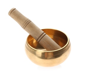 Photo of Golden singing bowl and mallet on white background.  Sound healing