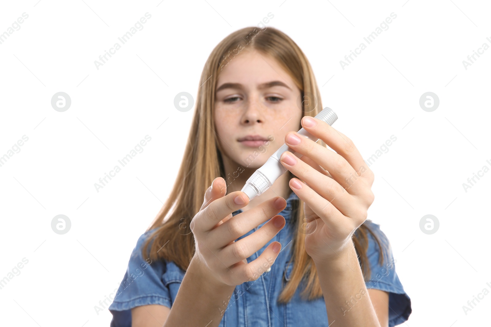 Photo of Teen girl using lancet pen on white background. Diabetes control