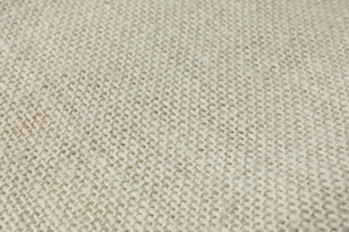 Photo of Texture of beige fabric as background, closeup