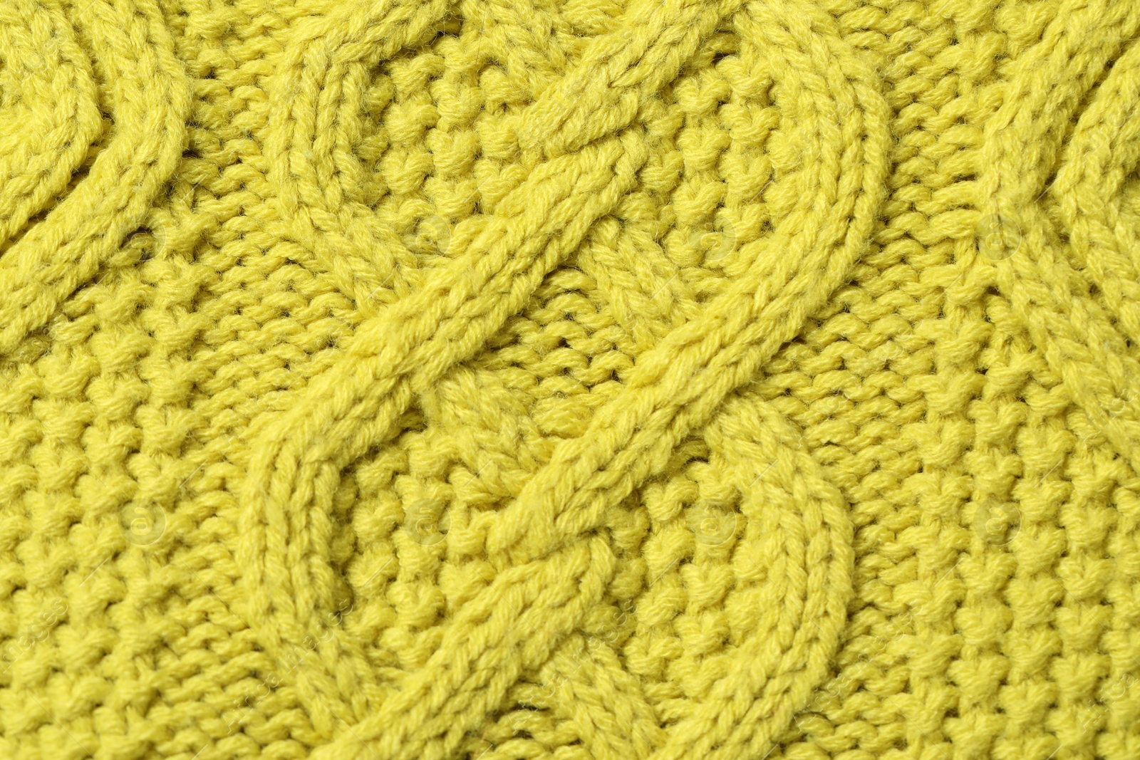 Photo of Texture of soft yellow fabric as background, top view