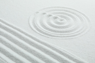Photo of White sand with pattern. Zen and harmony