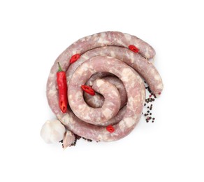 Homemade sausages, garlic, chili and peppercorns isolated on white, top view