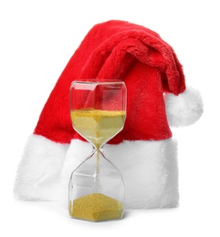 Hourglass with Santa hat on white background. Christmas countdown