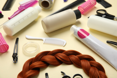 Photo of Professional tools for hair dyeing on light background