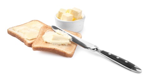 Tasty toasts with butter and knife on white background