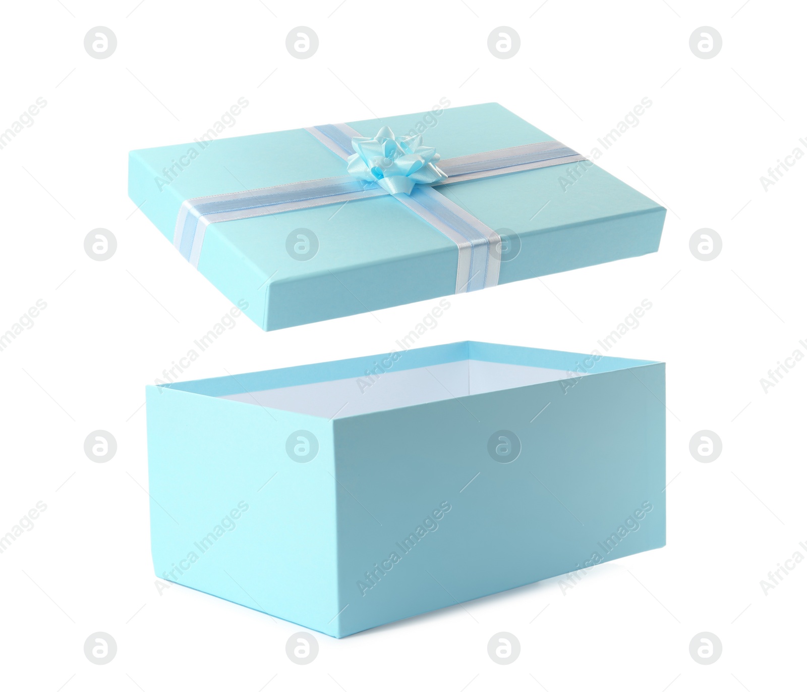 Photo of Light blue gift box and lid with bow on white background