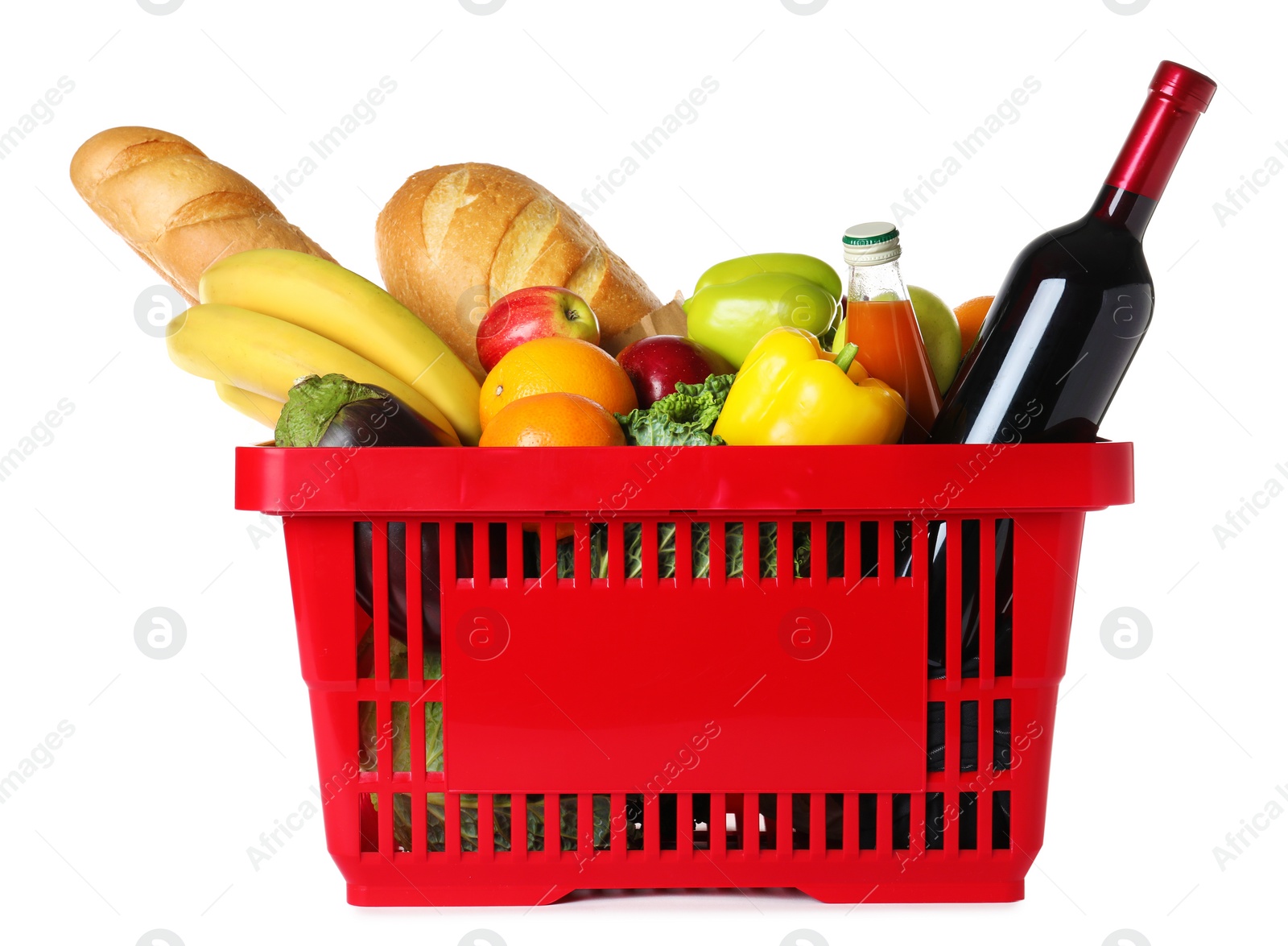 Photo of Shopping basket with grocery products on white background