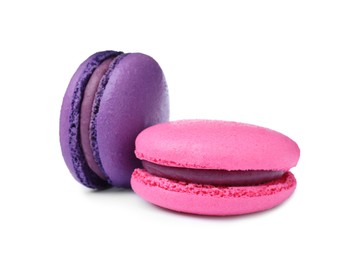 Photo of Different delicious colorful macarons on white background