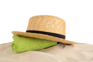 Photo of Beach accessories on sand against white background