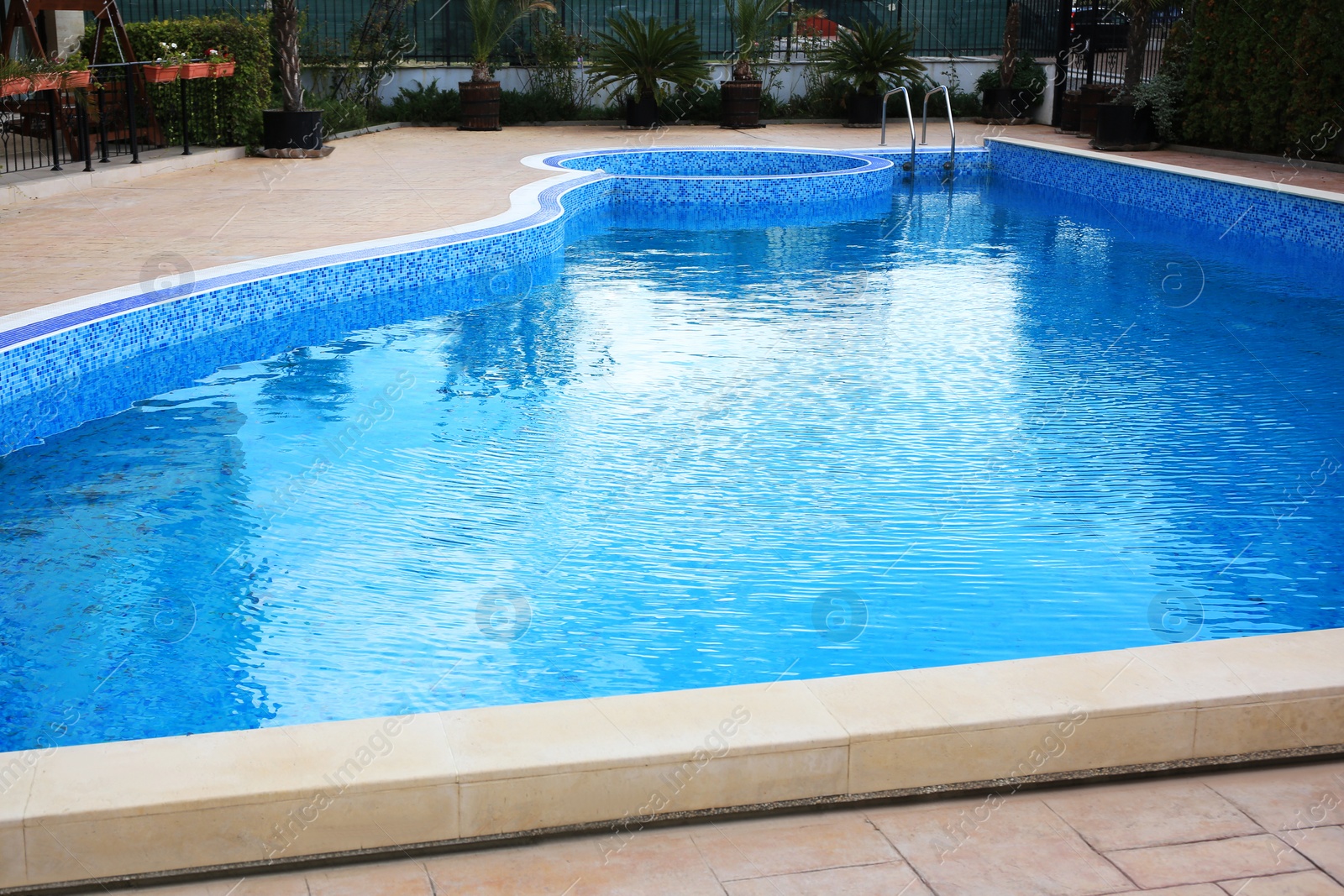 Photo of Pool with clean water near buildings outdoors