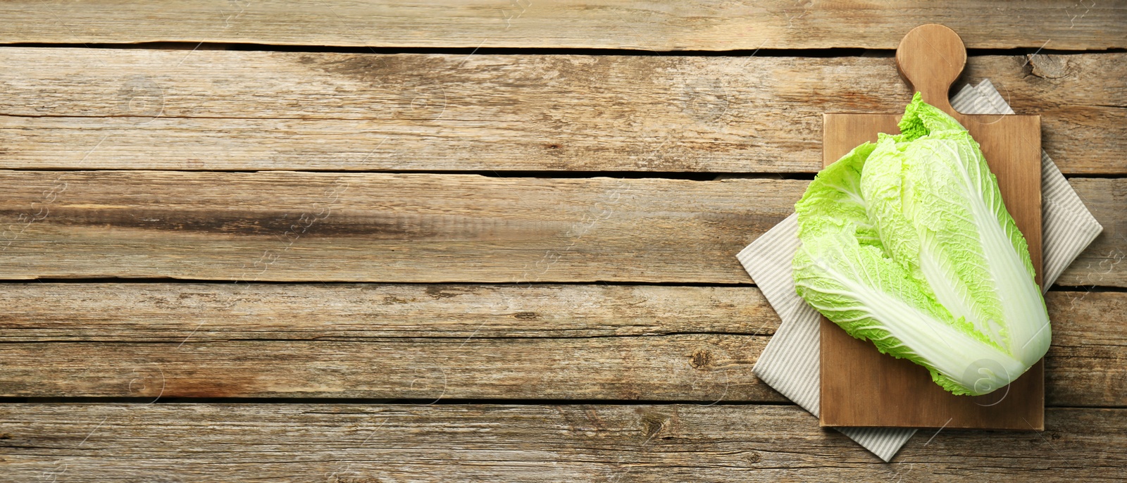 Image of Fresh ripe Chinese cabbage on wooden table, top view. Banner design with space for text