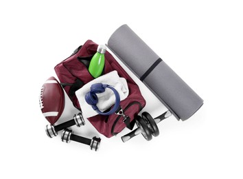 Photo of Gym bag and sports equipment on white background, top view