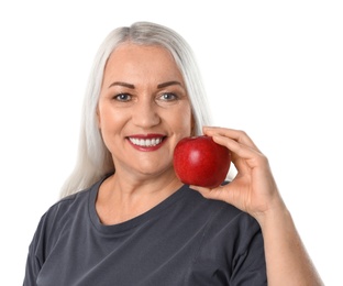 Photo of Smiling woman with perfect teeth and red apple on white background