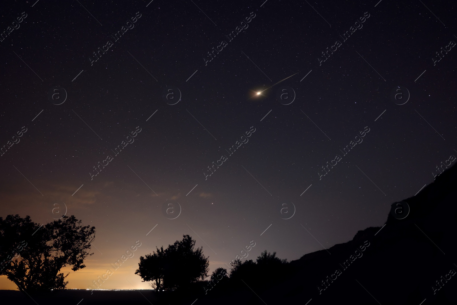 Image of Beautiful view of shooting star in night sky