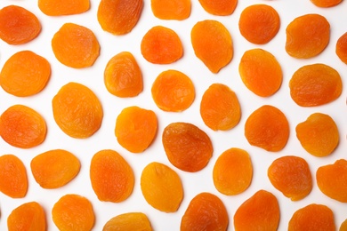 Photo of Flat lay composition with dried apricots on  white background. Healthy fruit