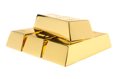 Photo of Precious shiny gold bars on white background