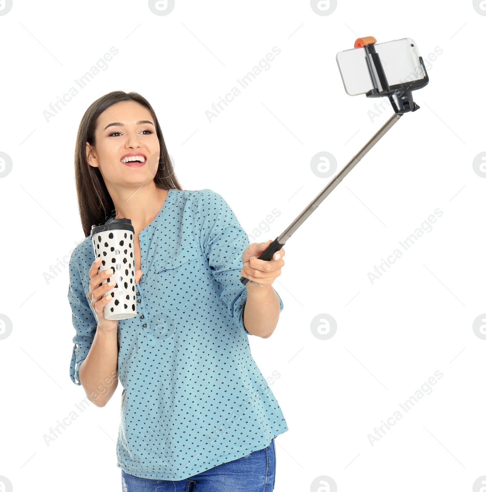 Photo of Young beautiful woman taking selfie against white background