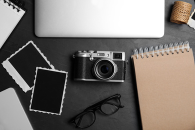 Photo of Workplace of designer with camera, flat lay