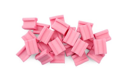 Photo of Pile of tasty pink chewing gums on white background, top view