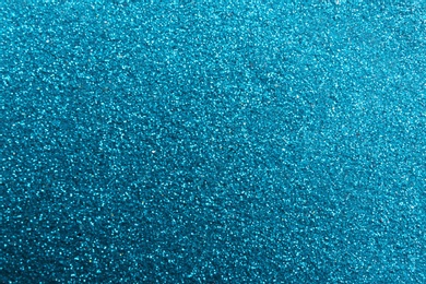 Closeup view of sparkling blue glitter background