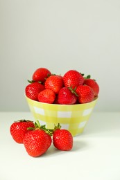 Photo of Fresh ripe juicy strawberries on white table