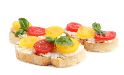 Tasty fresh tomato bruschettas on white background