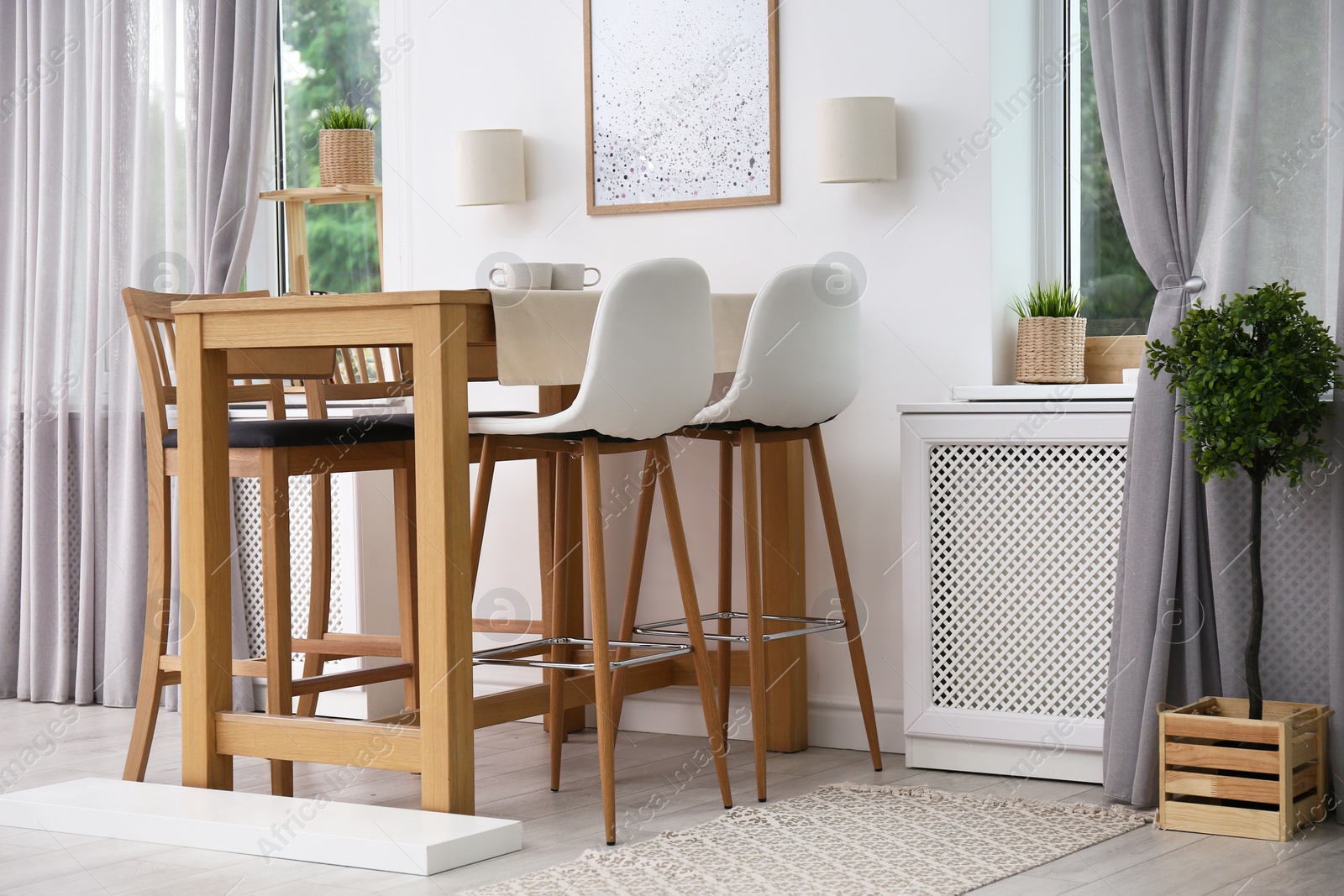 Photo of Modern room interior with wooden dining table