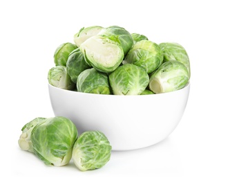 Photo of Fresh Brussels sprouts in bowl isolated on white