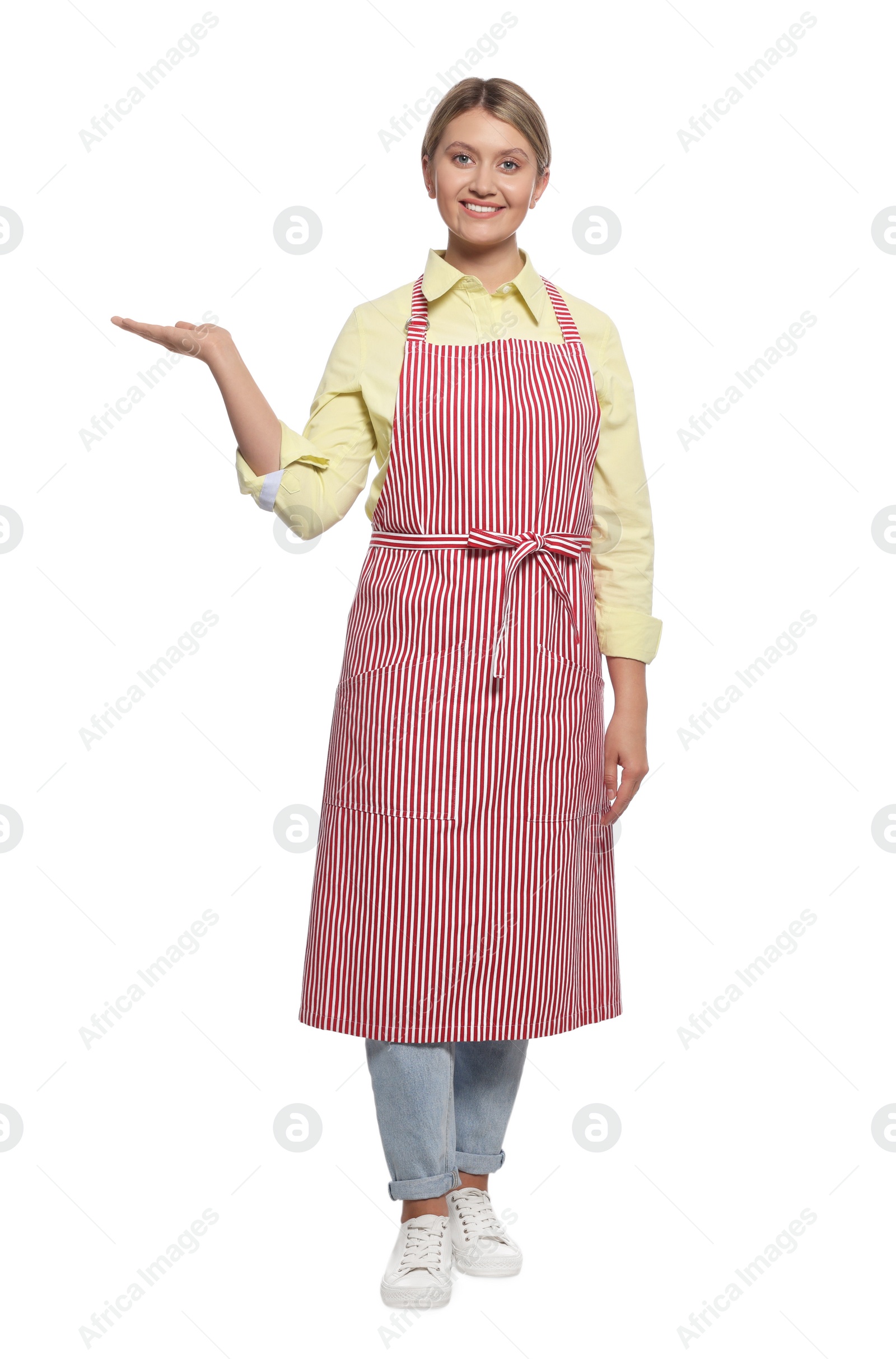 Photo of Beautiful young woman in clean striped apron on white background