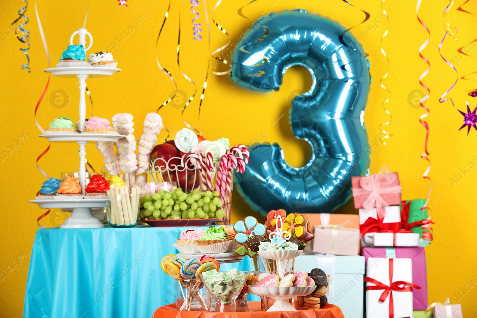 Photo of Dessert table in room decorated with blue balloon for 3 year birthday party