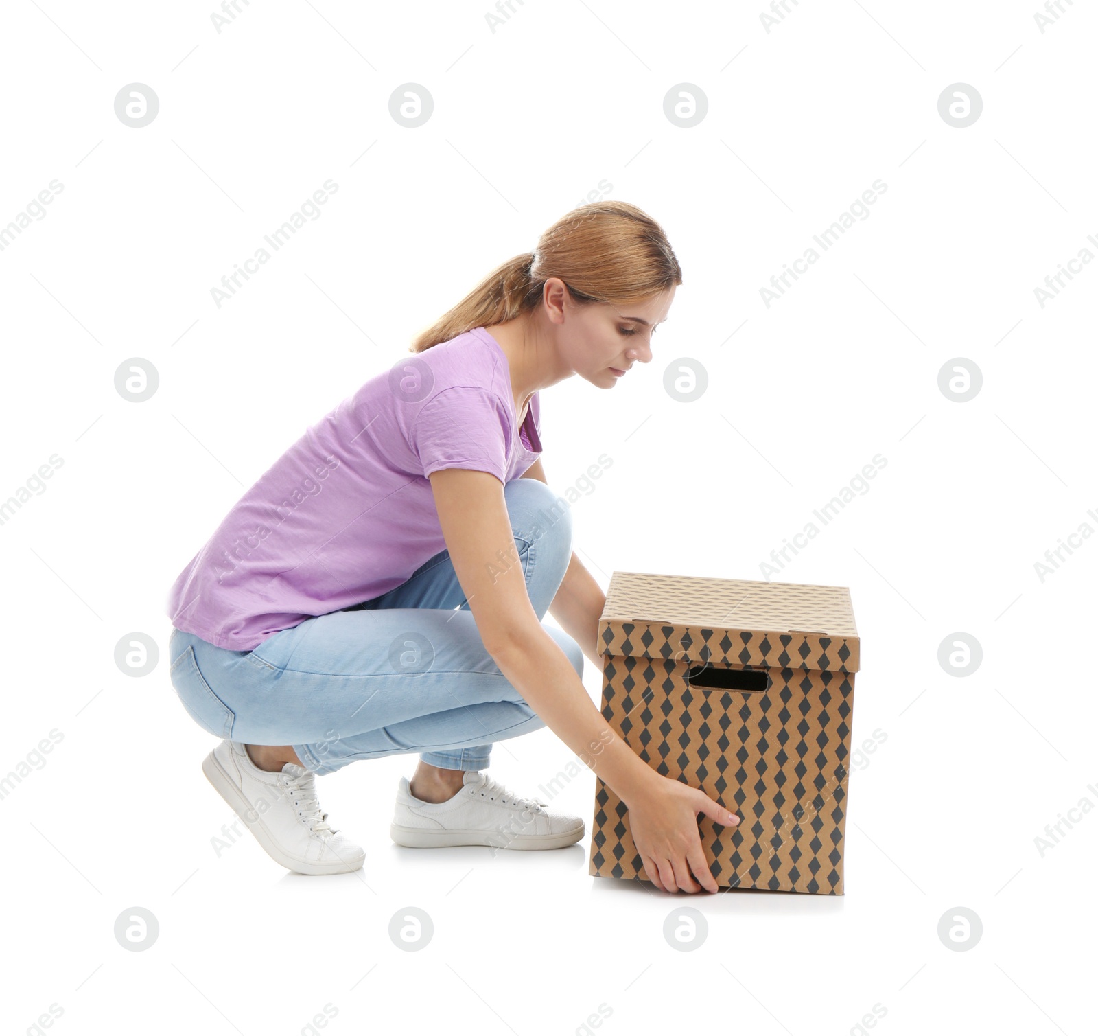 Photo of Full length portrait of woman lifting carton box on white background. Posture concept